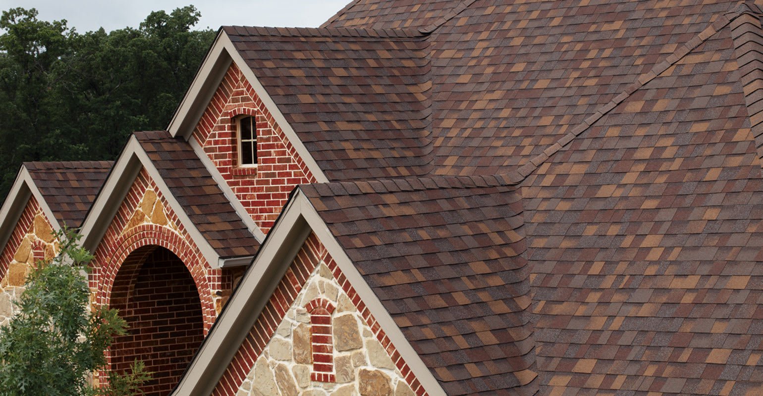 red brick home with sedona canyon roof shingles